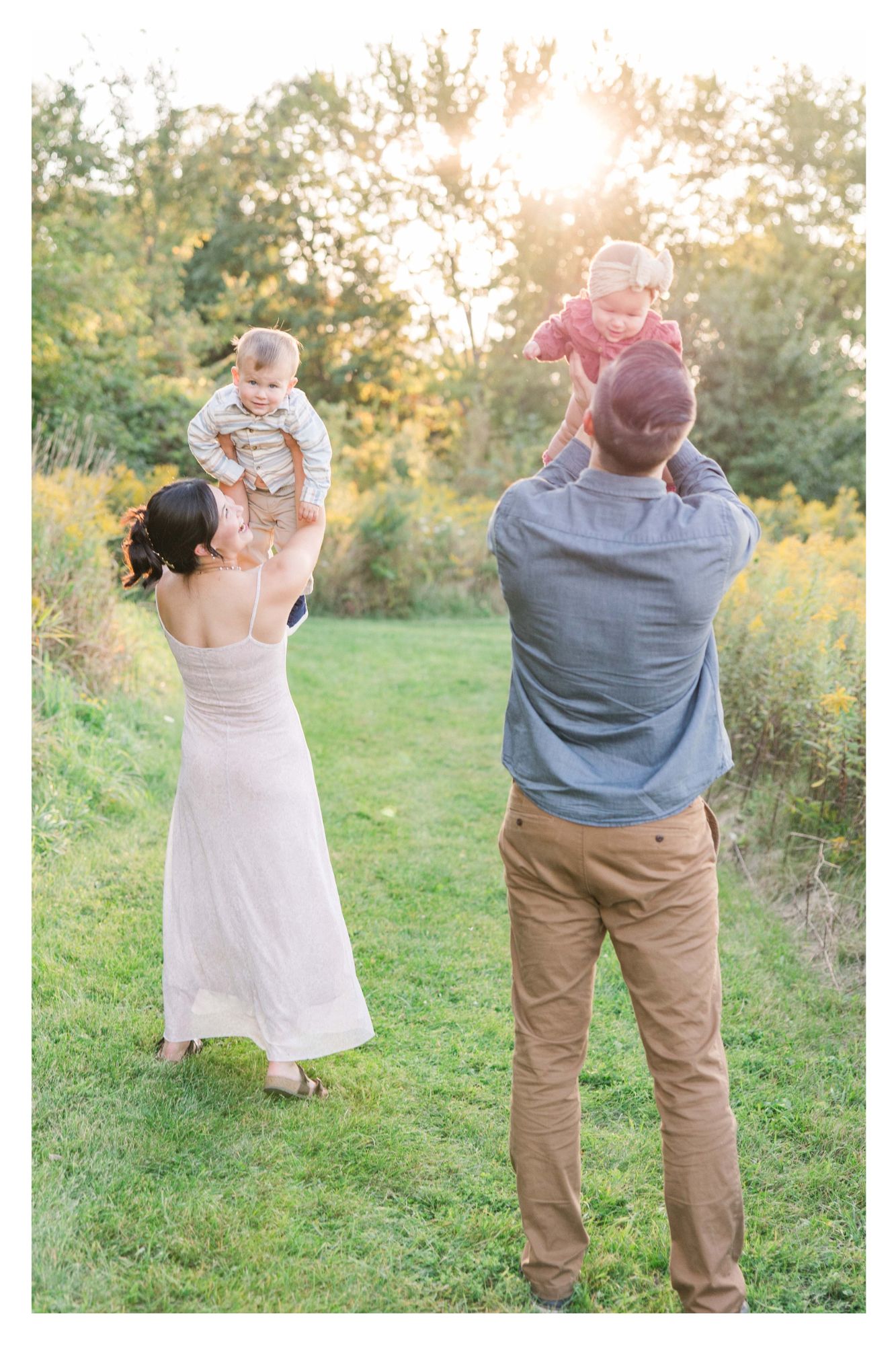 Family playing together at sunset